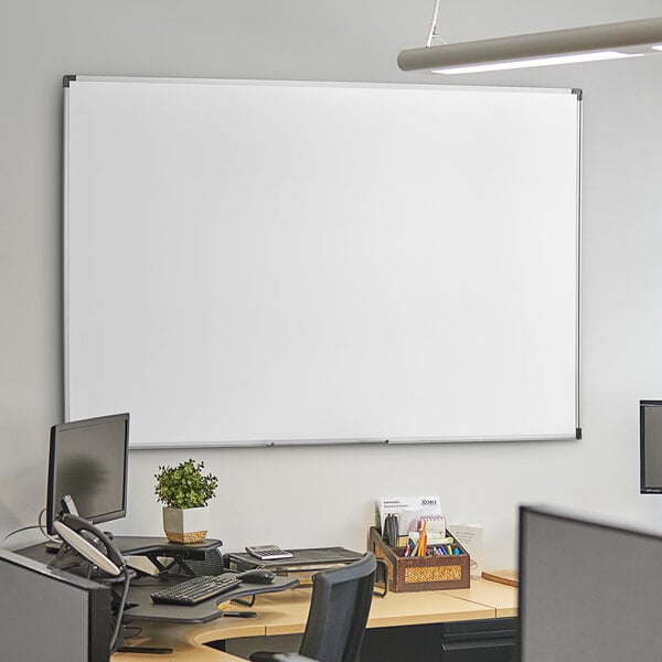 A Dynamic by 360 Office Furniture whiteboard mounted on a white wall.