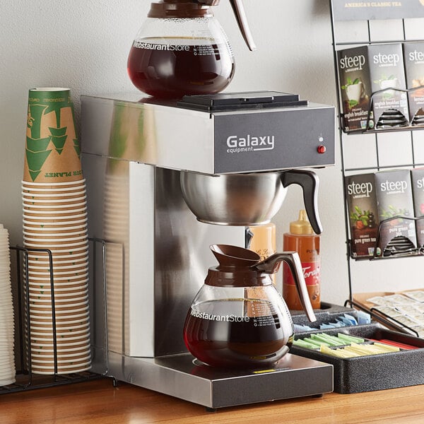 A Galaxy commercial pourover coffee maker on a counter with coffee in a glass pot.