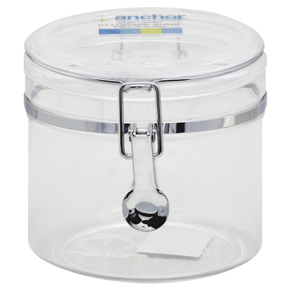 A clear Anchor Hocking plastic canister with a metal clamp lid.