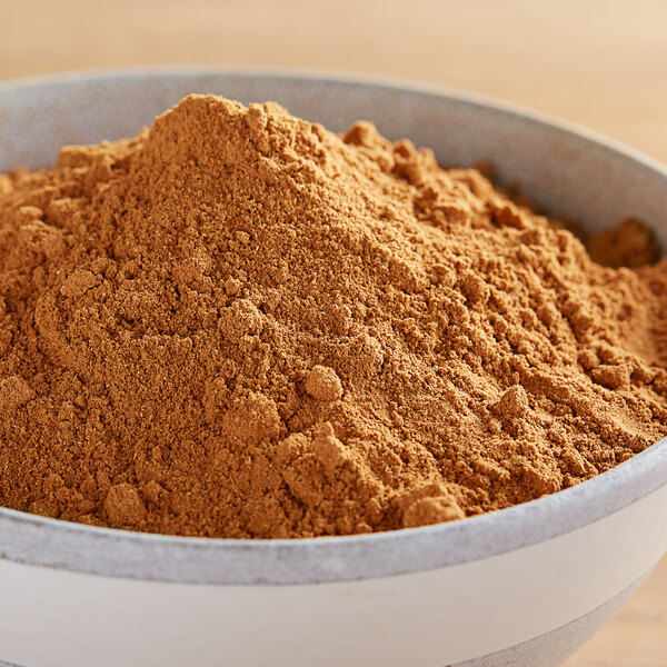 A bowl of Regal Five Spice powder on a table.