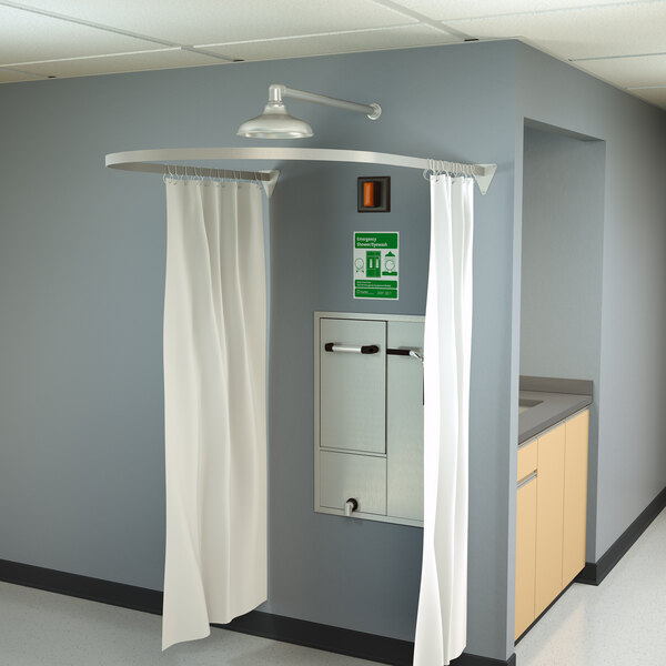 A Guardian Equipment modesty curtain for a recessed laboratory eye wash station.