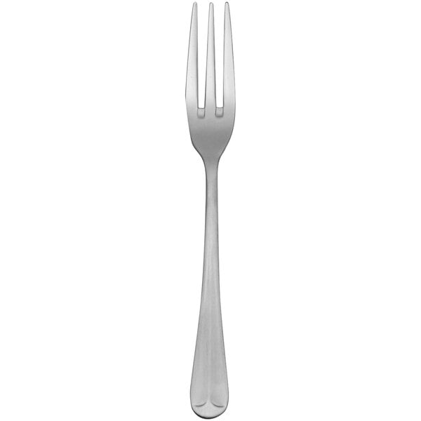 A silver Delco Old English stainless steel dinner fork with three tines on a white background.