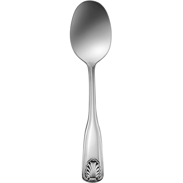 A silver Delco Laguna stainless steel dinner spoon with a shell design on the handle.