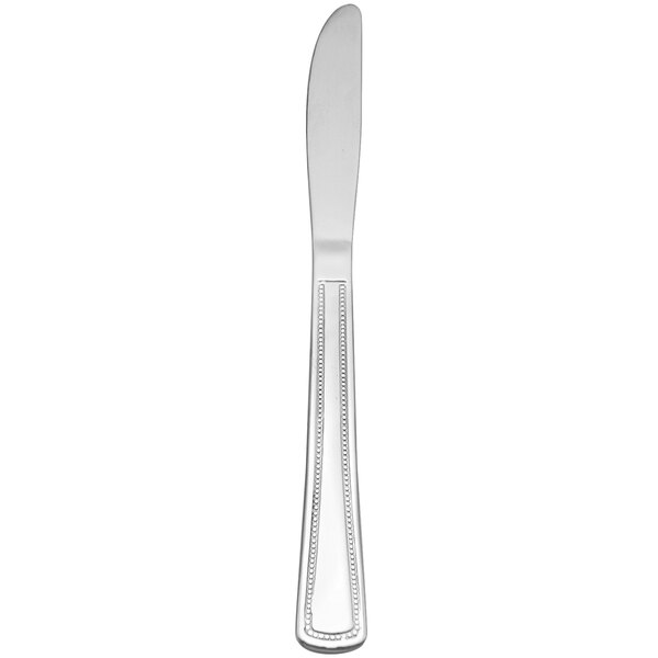 A silver Delco Belmore stainless steel dinner knife with a rectangular handle.