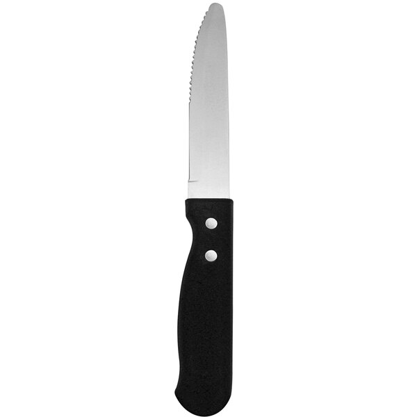 A Delco Wrangler stainless steel steak knife with a black poly handle.