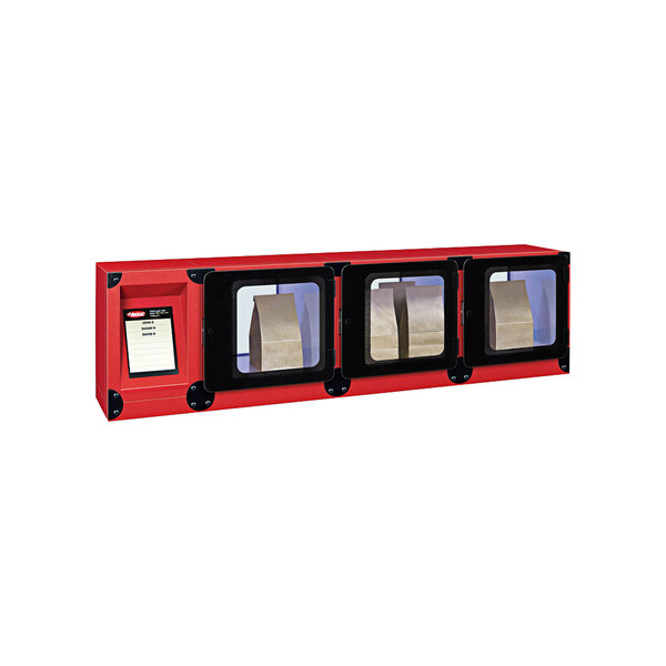 A red box with a rectangular object with three black doors with silver frames.