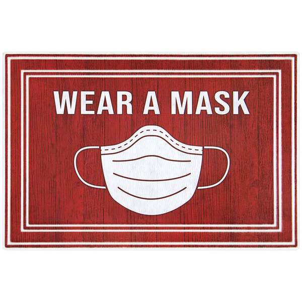 A red and white rectangular entrance mat with the words "Wear A Mask" in white.
