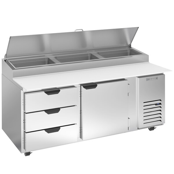 A stainless steel Beverage-Air refrigerated pizza prep table with 3 drawers and a clear lid.