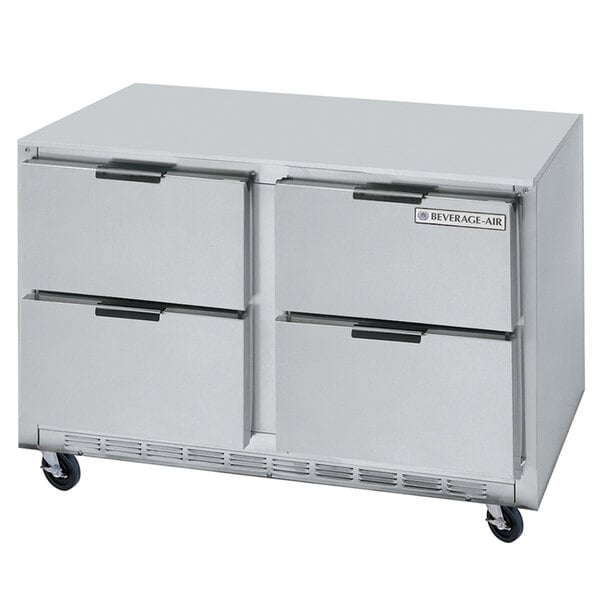 A stainless steel Beverage-Air undercounter refrigerator with four drawers on wheels.