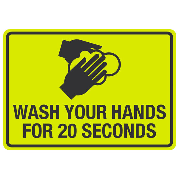 A yellow sign with black text reading "Wash Your Hands For 20 Seconds" with a symbol of hands washing.