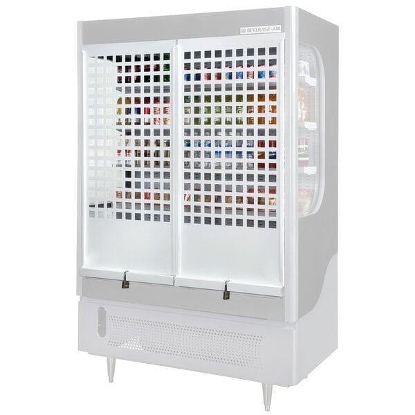 A white Beverage-Air cooler with a door open and a grid security cage inside.