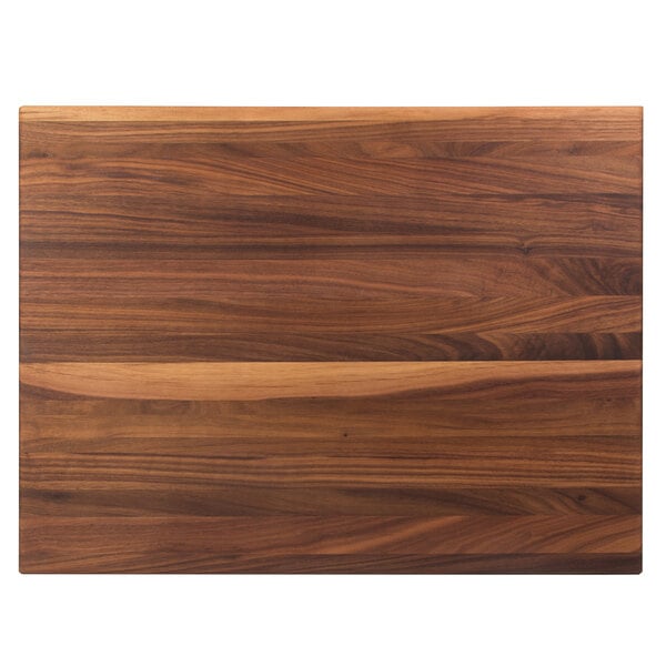 A John Boos black walnut wood cutting board on a table.