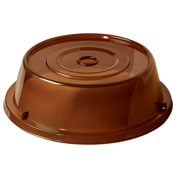 A brown plastic lid with a hole for a plate.