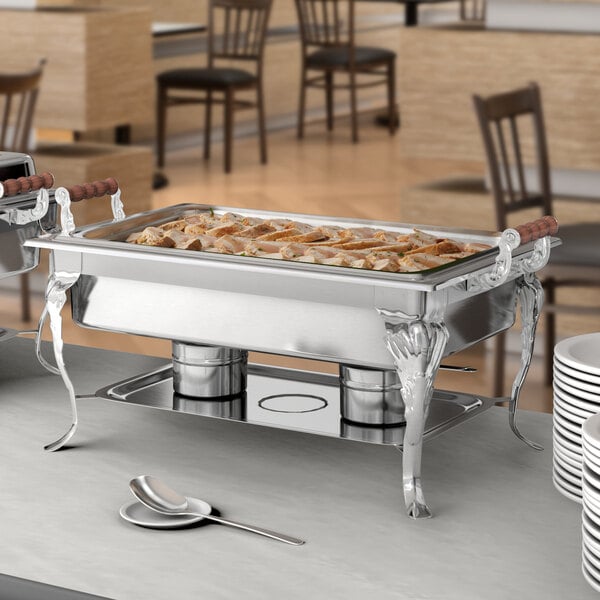 A buffet table with a Choice Classic chafing dish on it.
