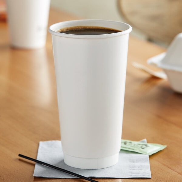 A close-up of a white Choice paper hot cup.