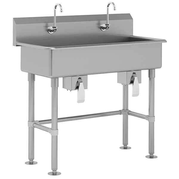 A stainless steel Advance Tabco hand sink with two knee valve faucets.