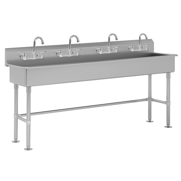 A stainless steel Advance Tabco multi-station hand sink with faucets.