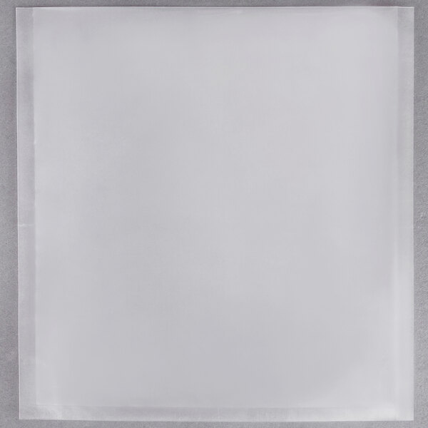 A white square ARY VacMaster vacuum packaging bag with a black border on a gray surface.
