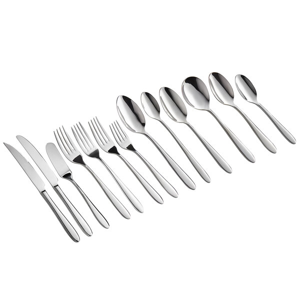 A row of Acopa Remy stainless steel dinner knives.