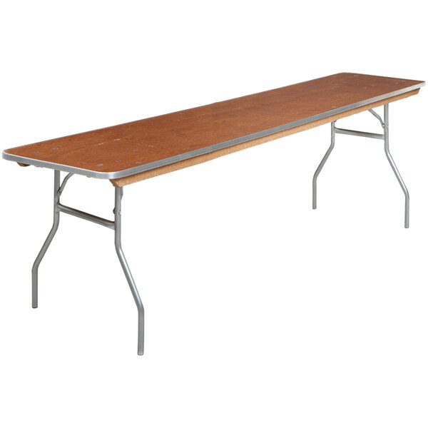 A long rectangular Resilient folding seminar table with wood top and metal wishbone legs.