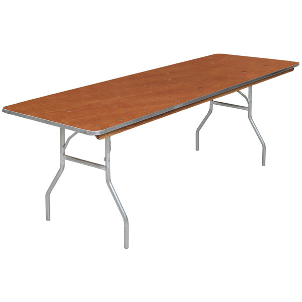 A Resilient rectangular wood seminar table with metal legs.