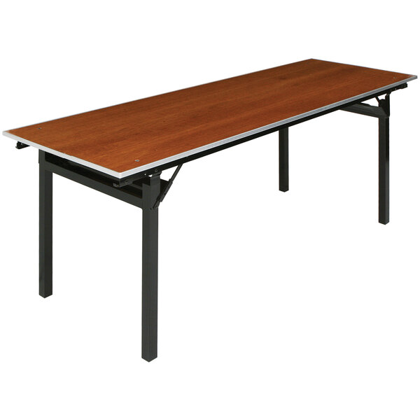 A Resilient seminar table with a wooden top and black square legs.