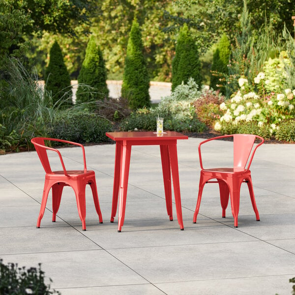 Lancaster Table & Seating Alloy Series 23 1/2" x 23 1/2" Ruby Red Standard Height Outdoor Table with 2 Arm Chairs