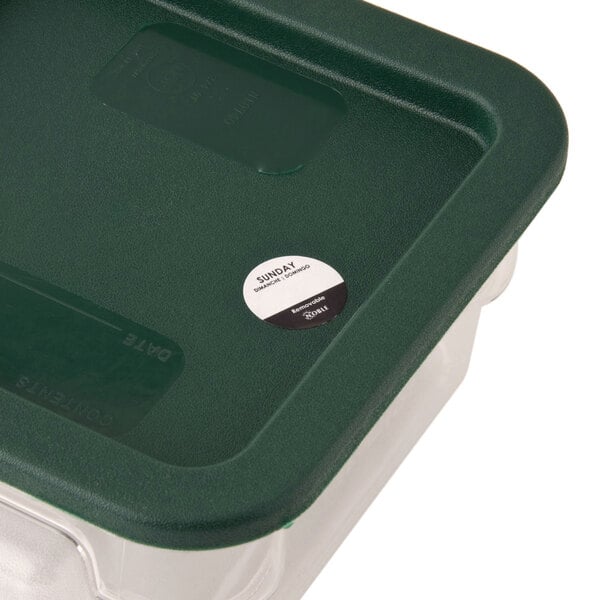 A plastic container of Noble Products Sunday Removable Day of the Week labels with a green lid.