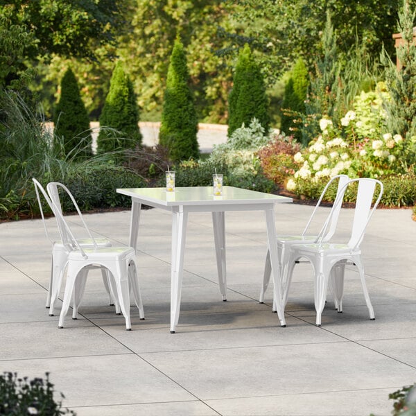 Lancaster Table & Seating Alloy Series 47 1/2" x 29 1/2" Pearl White Standard Height Outdoor Table with 4 Cafe Chairs