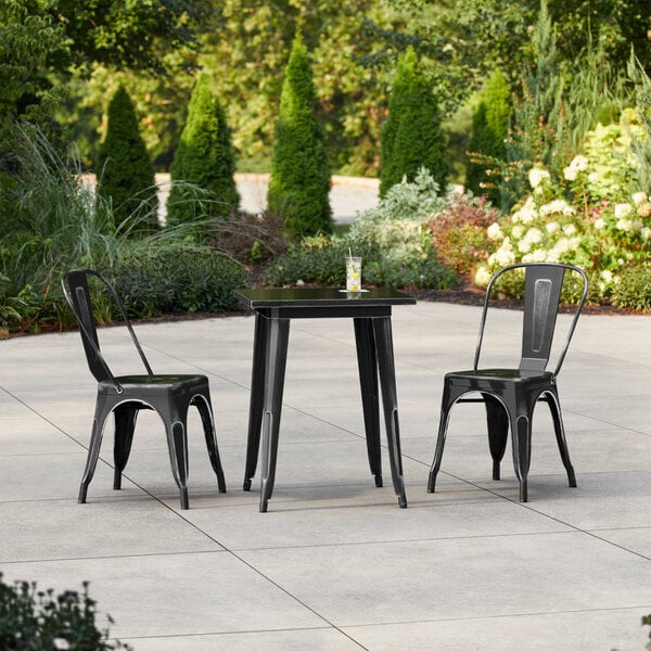Lancaster Table & Seating Alloy Series 23 1/2" x 23 1/2" Distressed Onyx Black Standard Height Outdoor Table with 2 Cafe Chairs