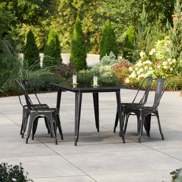Lancaster Table & Seating Alloy Series 47 1/2" x 29 1/2" Distressed Onyx Black Standard Height Outdoor Table with 4 Cafe Chairs