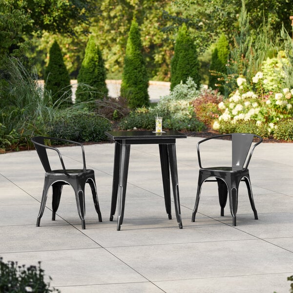 Lancaster Table & Seating Alloy Series 23 1/2" x 23 1/2" Distressed Black Standard Height Outdoor Table with 2 Arm Chairs