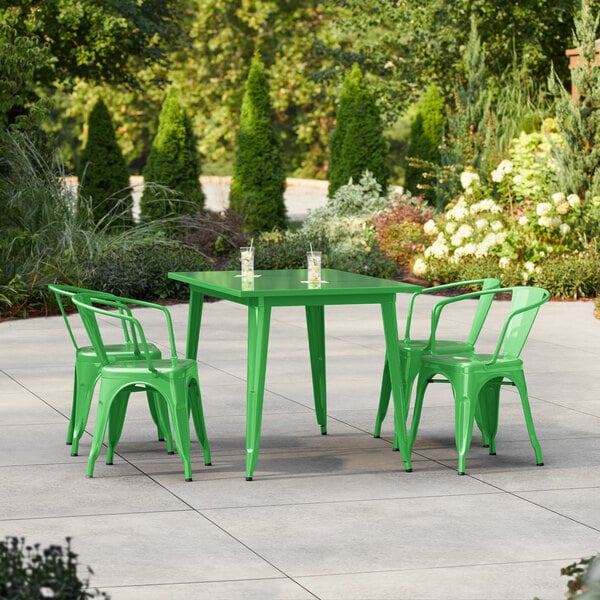 Lancaster Table & Seating Alloy Series 47 1/2" x 29 1/2" Jade Green Standard Height Outdoor Table with 4 Arm Chairs