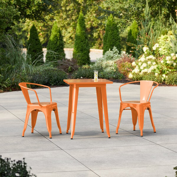 Lancaster Table & Seating Alloy Series 23 1/2" x 23 1/2" Orange Standard Height Outdoor Table with 2 Arm Chairs