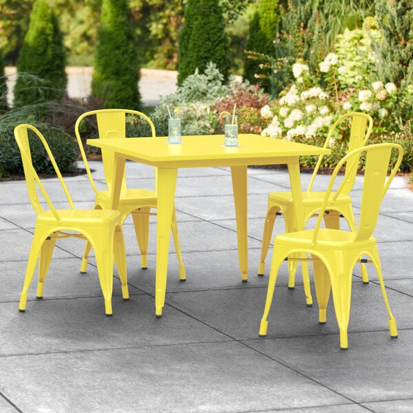 Lancaster Table & Seating Alloy Series 36" x 36" Yellow Dining Height Outdoor Table with 4 Industrial Cafe Chairs
