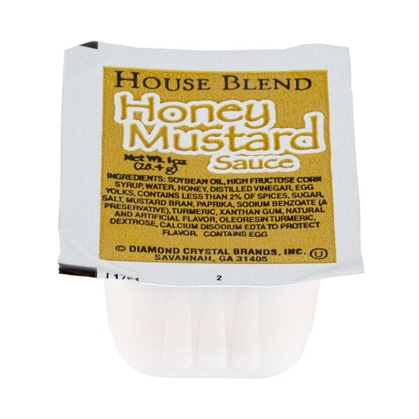 A small container of house blend honey mustard sauce.