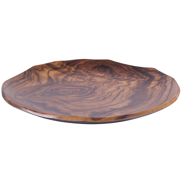 An Elite Global Solutions Sequoia wood grain melamine plate with a round shape and pattern.