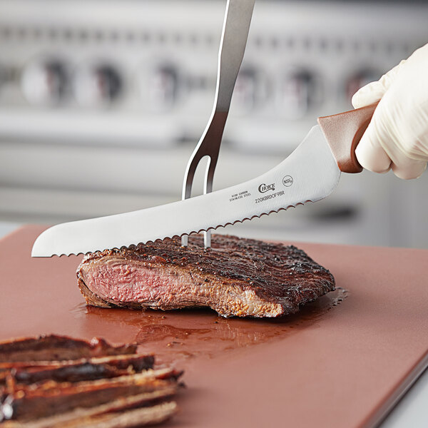 A person using a Choice bread knife to cut a piece of meat on a cutting board.
