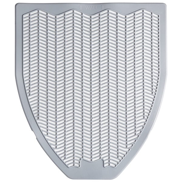 A gray shield-shaped disposable urinal mat with a pattern of lines on it.