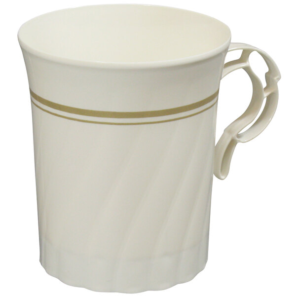 A close-up of a white coffee cup with gold stripes.