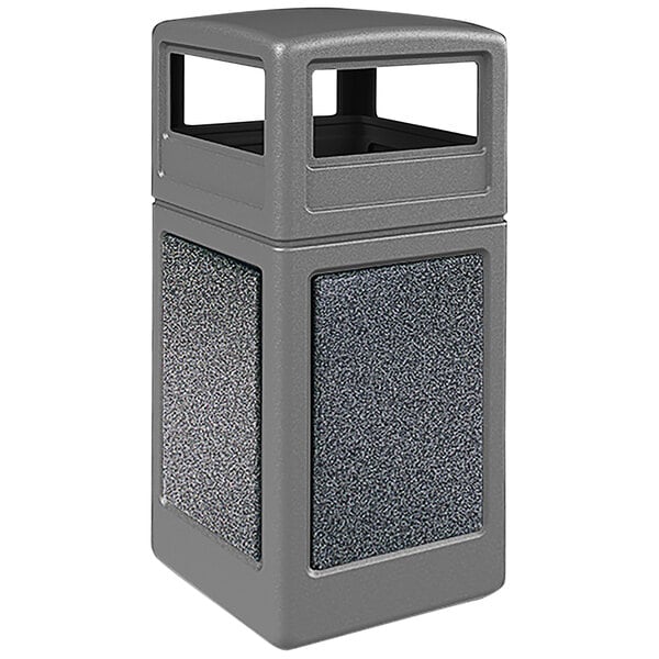 A grey StoneTec waste receptacle with pepperstone panels and a square top.