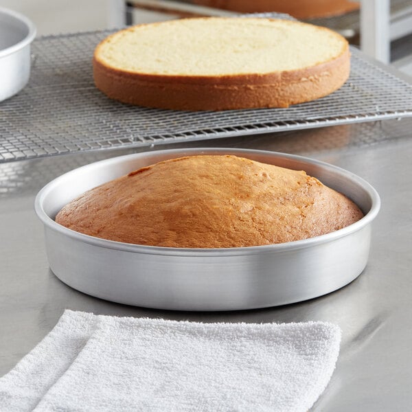 A round cake in a Choice round aluminum cake pan.