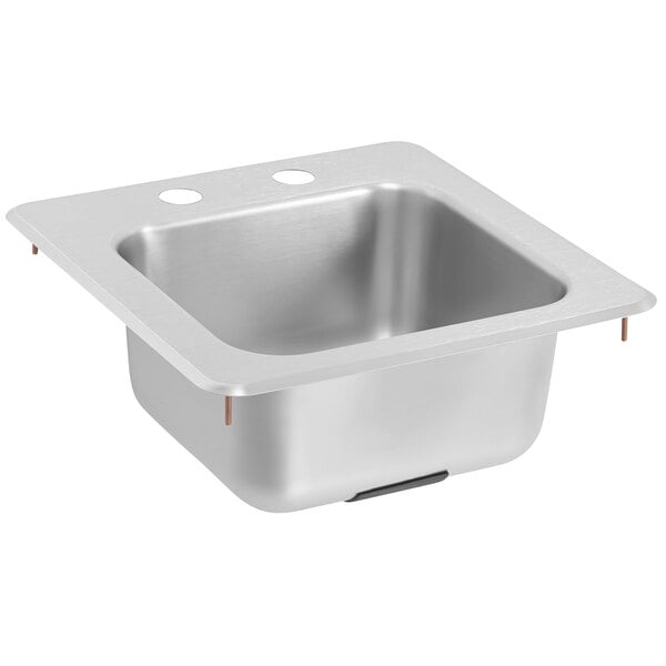 A silver  Vollrath stainless steel sink with two holes in the bottom.