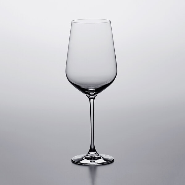 A Lucaris Bordeaux wine glass on a white surface.