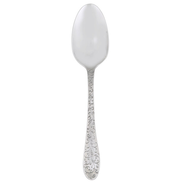 A Oneida Ivy Flourish large silver serving spoon with a pattern on the handle.