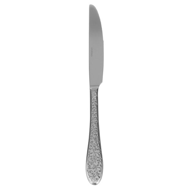 A Oneida Ivy Flourish stainless steel dinner knife with a design on the handle.