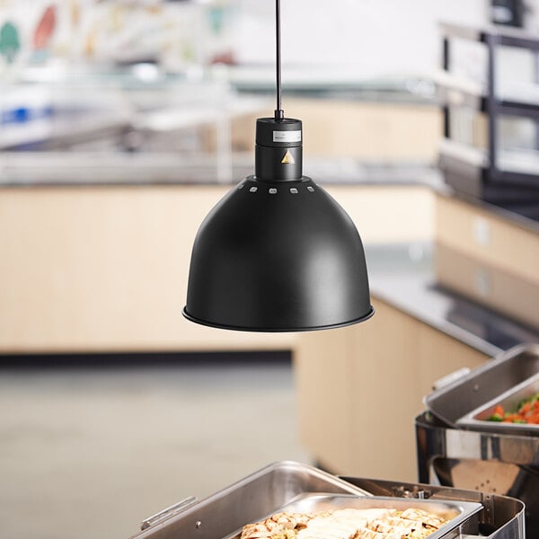 A black ceiling mount heat lamp from ServIt over a buffet table.