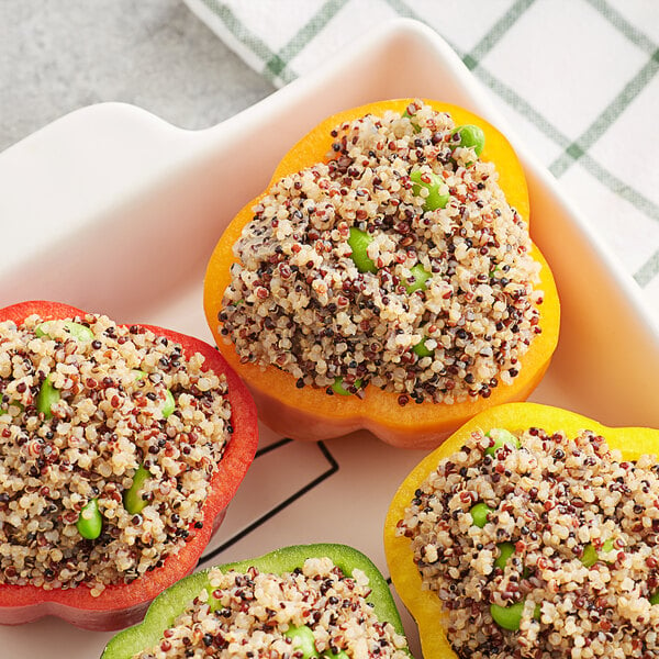 A group of peppers stuffed with Furmano's tri-color quinoa and peas.