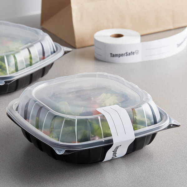 A plastic food container with a TamperSafe label on it.