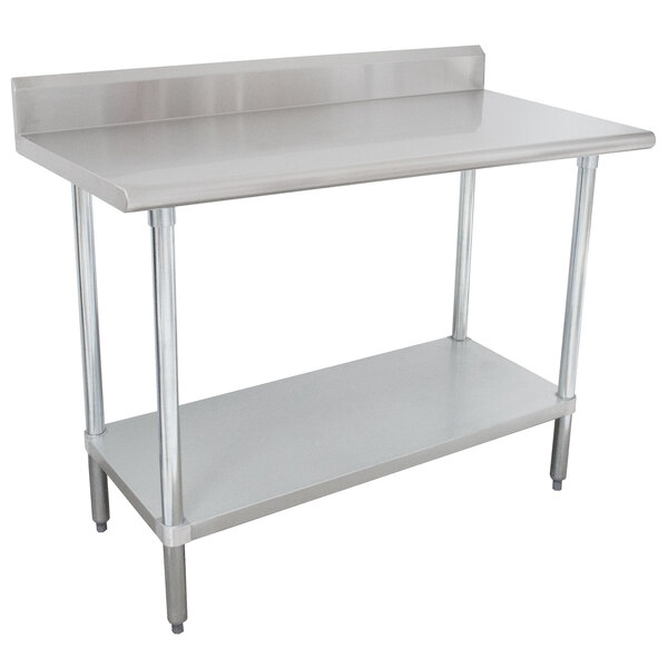 A white rectangular Advance Tabco stainless steel work table with undershelf.